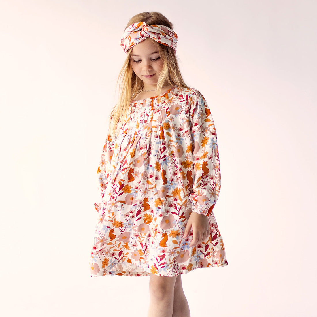 Cream dress with long sleeves and flower all over print in viscose, child